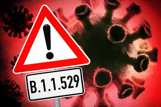 PHOTOMONTAGE, coronavirus and warning sign, symbol photo Omikron variant B 1 1 529 ** NUR FUER REDAKTIONELLE ZWECKE ** EDITORIAL USE ONLY **