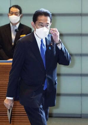 Japanese Prime Minister Kishida Japanese Prime Minister Fumio Kishida arrives at his office in Tokyo on Nov. 29, 2021, wearing a face mask for protection against the coronavirus.  A14AA0000941527P
