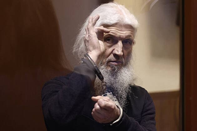 MOSCOW, RUSSIA - NOVEMBER 30, 2021: Unordained schema hegumen Sergius (Nikolai Romanov), charged with unsanctioned actions encouraging people to kill themselves and violating the right for freedom of religion over his calling on the faithful to oppose COVID-19 restrictions, attends a sententing hearing at Moscowâ€™s Izmailovsky District Court. The court found Romanov guilty on the three charges and sentenced him to 3 and a half years in prison colony. Romanov was arrested at the Sredneuralsk Convent and sent to Moscow on 29 December 2020; he was excommunicated in May 2020 for violating a ban on preaching after calling on people to go to church despite the lockdown, describing the coronavirus situation as a fake pandemic . More recently, Serg  TS11A163