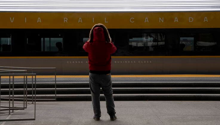November 30, 2021, Ottawa, ON, Canada: A person takes a photo of a new Via Rail train as it sits on display at the train station in Ottawa, Tuesday, November 30, 2021 in Ottawa. Via Rail displayed the first of its new state of the art trains which will serve the Windsor-Quebec city corridor. Ottawa Canada  - ZUMAc35_ 20211130_zaf_c35_011 Copyright: xAdrianxWyldx