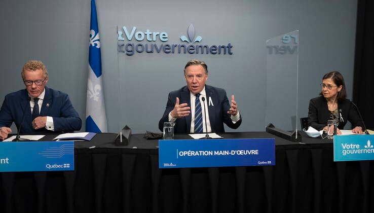 November 30, 2021, QUEBEC, PQ, Canada: Quebec Premier Francois Legault announces an operation to obtain more manpower, Tuesday, November 30, 2021 in Quebec City. Legault is flanked by Quebec Labour, Employment and Social Solidarity minister Jean Boulet, left, and Quebec Minister of Higher Education Danielle McCann. QUEBEC Canada - ZUMAc35_ 20211130_zaf_c35_020 Copyright: xJacquesxBoissinotx
