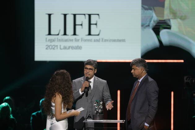 Laureates Rahul Choudhary and Ritwick Dutta, Legal Initiative for Forest and Environment LIFE , India, with presenter Gina Dirawi, at the 2021 Right Livelihood Award ceremony at Cirkus, in Stockholm, Sweden on December 01, 2021 LIFE received the prize for their innovative legal work empowering communities to protect their resourc  Copyright: xSörenxAnderssonx xTTx SWEDEN RIGHT LIVELIHOOD AWARD