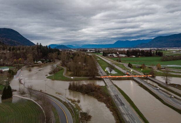 December 1, 2021, ABBOTSFORD, BC, CANADA: A Tiger Dam is placed across all lanes of the closed Trans-Canada Highway near the flooded Sumas River, in Abbotsford, B.C., on Wednesday, December 1, 2021. ABBOTSFORD CANADA  - ZUMAc35_ 20211201_zaf_c35_098 Copyright: xDarrylxDyckx