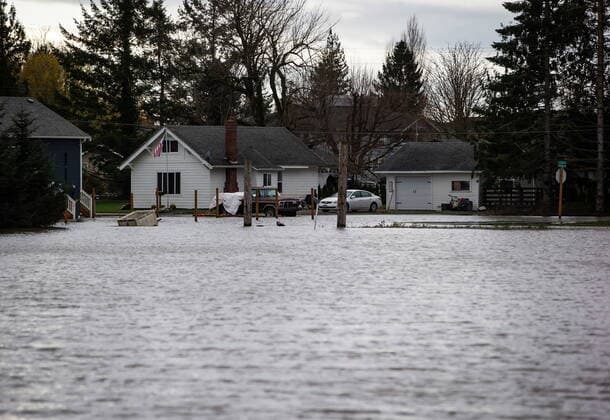 December 1, 2021, ABBOTSFORD, BC, CANADA: Floodwaters surround a home in Sumas, Wash., as seen from just across the Canada-U.S. border in Abbotsford, B.C., on Wednesday, December 1, 2021. ABBOTSFORD CANADA - ZUMAc35_ 20211201_zaf_c35_101 Copyright: xDarrylxDyckx