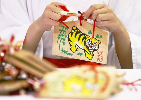 Decorative arrows for New Year Making of hamaya decorative arrows for New Year is under way at Atsuta Jingu shrine in Nagoya, central Japan, on Dec. 2, 2021. An ema votive tablet with an illustration of a tiger is attached to each arrow as 2022 is the year of the tiger in the Chinese zodiac.  A14AA0001155569P