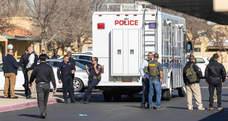 December 2, 2021, Albuquerque, New Mexico, USA: Albuquerque..Officers and investigators stand outside an apartment at Villa Hermosa apartment complex, as they investigate an Officer Involved Shooting on December 02, 2021. for the Albuquerque Journal.Albuquerque, New Mexico Albuquerque USA - ZUMAab1_ 20211202_zaf_ab1_009 Copyright: xMikexSandovalx