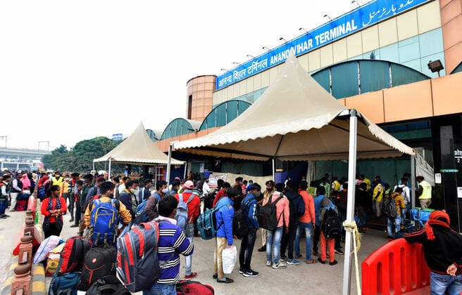 NEW DELHI, INDIA - DECEMBER 2: Passengers line up for giving swab samples for coronavirus test during a special testing camp organised after Omicron Covid Variant identified at Anand Vihar Railway Station, on December 2, 2021 in New Delhi, India. (Photo by Sonu Mehta Hindustan Times) Daily Life Amid Coronavirus Pandemic In India