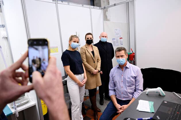 Prime Minister Mette Frederiksen S puts on plasters and directors of the National Board of Health Soeren Brostroem vaccinates when they visit covid 19 vaccination site in the old ticket office at Copenhagen Central Station, Friday 3 December 2021 The Prime Minister and Soere  Copyright: PhilipxDavali PhilipxDavalix cop105 spdk20211203-161007-L