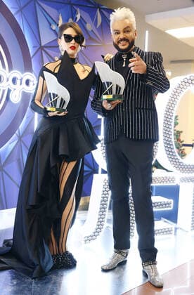 MOSCOW, RUSSIA - DECEMBER 4, 2021: Ukrainian songwriter and sound producer Victoria Kokhana (L) and singer Philipp Kirkorov, laureates of the Song of the Year 2021 prize, pose for a photograph during the Song of the Year 2021 concert at Megasport Arena. Artyom Geodakyan TASS  TS11AA74
