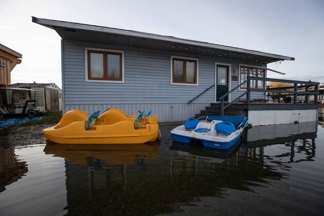 December 5, 2021, MISSION, BC, CANADA: Pedal boats sit in floodwaters outside a property at Everglades Resort on Hatzic Lake near Mission, B.C., on Sunday, December 5, 2021. MISSION CANADA  - ZUMAc35_ 20211205_zaf_c35_116 Copyright: xDarrylxDyckx