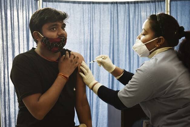 GURUGRAM, INDIA - DECEMBER 5: A person gets vaccinated against Covid-19, at UPHC, on December 5, 2021 in Gurugram, India. (Photo by Vipin Kumar Hindustan Times) Daily Life Amid Covid-19 pandemic In India