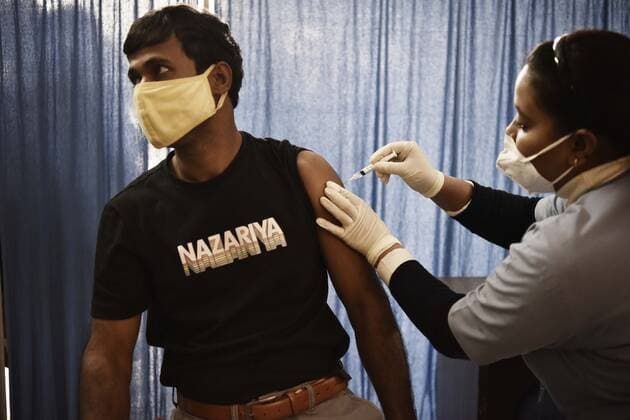 GURUGRAM, INDIA - DECEMBER 5: A person gets vaccinated against Covid-19, at UPHC, on December 5, 2021 in Gurugram, India. (Photo by Vipin Kumar Hindustan Times) Daily Life Amid Covid-19 pandemic In India
