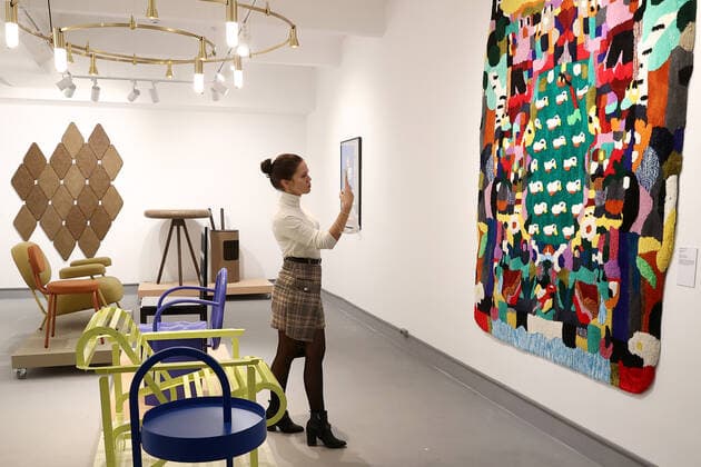 MOSCOW, RUSSIA â€“ DECEMBER 6, 2021: A woman visits an exhibition titled The History of Russian Design â€“ The Best of 1917-2022 and held at the New Tretyakov Gallery, the first to feature a vast collection of the Moscow Design Museum. Artyom Geodakyan TASS  TS11AE06
