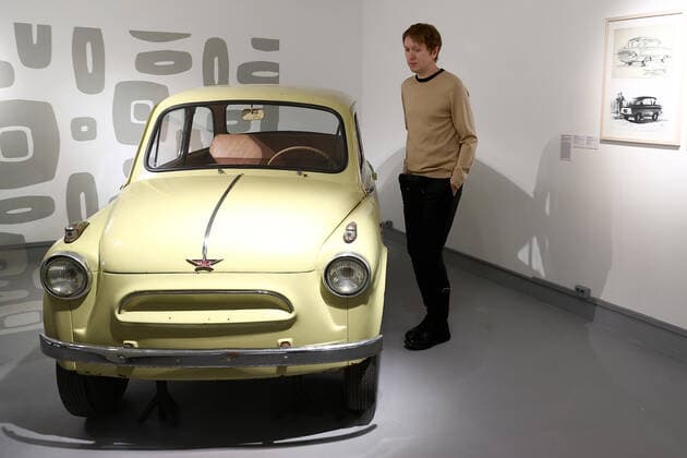 MOSCOW, RUSSIA â€“ DECEMBER 6, 2021: A man stands next to a ZAZ-965 Zaporozhets compact car during an exhibition titled The History of Russian Design â€“ The Best of 1917-2022 and held at the New Tretyakov Gallery, the first to feature a vast collection of the Moscow Design Museum. Artyom Geodakyan TASS  TS11AE2D