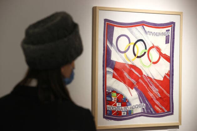 MOSCOW, RUSSIA â€“ DECEMBER 6, 2021: A woman stands befor a 1980 Summer Olympics neckerchief on display during an exhibition titled The History of Russian Design â€“ The Best of 1917-2022 and held at the New Tretyakov Gallery, the first to feature a vast collection of the Moscow Design Museum. Artyom Geodakyan TASS  TS11AE34