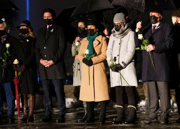 December 6, 2021, Montreal, PQ, Canada: Sophie Gregoire, from left to right, Prime Minister Justin Trudeau, Montreal mayor Valerie Plante, survivor Nathalie Provost, and Quebec Premier Francois Legault pause during a vigil in memory of the 14 victims of the 1989 Ecole Polytechnique Montreal tragedy, in Montreal, Monday, Dec. 6, 2021. Montreal Canada - ZUMAc35_ 20211206_zaf_c35_056 Copyright: xPaulxChiassonx