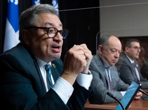 December 7, 2021, QUEBEC, PQ, Canada: Horacio Arruda, left, Quebec director of National Public Health responds to reporters questions during a news conference on the COVID-19 pandemic, Tuesday, December 7, 2021 at the legislature in Quebec City. Quebec Health Minister Christian Dube, centre and Daniel Pare, director of the vaccination campaign, look on. QUEBEC Canada - ZUMAc35_ 20211207_zaf_c35_039 Copyright: xJacquesxBoissinotx