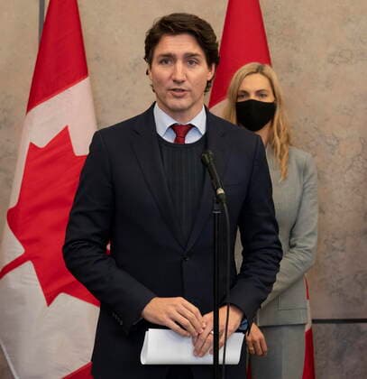 December 8, 2021, Ottawa, ON, Canada: Sport Minister Pascale St-Onge looks on as Canadian Prime Minister Justin Trudeau announces Canada will join a diplomatic boycott of the Winter Games in China following caucus, Wednesday, December 8, 2021 in Ottawa. Ottawa Canada  - ZUMAc35_ 20211208_zaf_c35_040 Copyright: xAdrianxWyldx