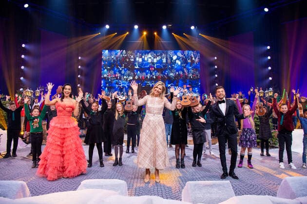 09-12-2021 Omispoort Queen Maxima with Buddy Vedder and Romy Monteiro attend the Chrismas musicgala 2021 at the Omnisport in Apeldoorn. 12 school classes, from each province, competed in the Lang Leve de Muziek Show for the title of the most musical class in the Netherlands. Â  Copyright: xPPEx
