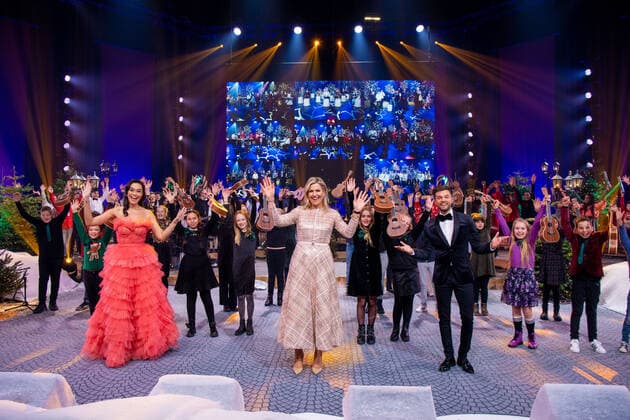 09-12-2021 Omispoort Queen Maxima with Buddy Vedder and Romy Monteiro attend the Chrismas musicgala 2021 at the Omnisport in Apeldoorn. 12 school classes, from each province, competed in the Lang Leve de Muziek Show for the title of the most musical class in the Netherlands. Â  Copyright: xPPEx