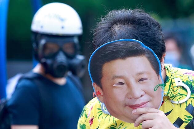 Protest Boycotting Beijing Winter Olympic Games 2022 A protester wearing a mask with the face of Chinese president Xi Jinping, during a protest boycotting the Beijing Winter Games 2022, outside the Bank of China (Taipei Branch), in Taipei, Taiwan, 10 December 2021. The United States, Canada, UK, and Australia have pledged not to send officials to attend the Games as a mean to boycott the China, following the disappearance of Chinese tennis player Peng Shuai and human rights crackdowns on Hong Kong and Xinjiang. Taipei Taiwan  Copyright: xCengxShouxYix originalFilename:ceng-notitle211210_npHYt.jpg