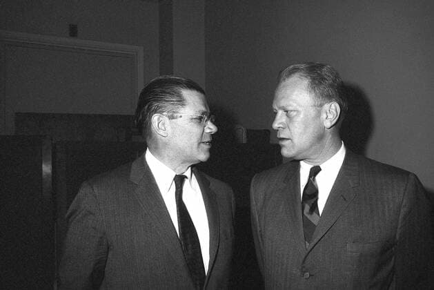Secretary of Defense Robert S. McNamara, left, talks with Representative Gerald R. Ford (R-Michigan) prior to a meeting with the House Committee on Defense Appropriations at the Capitol. 1062_05_L_-9744-