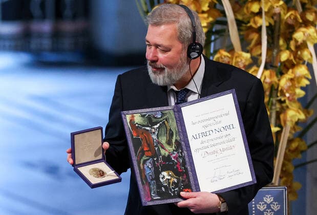 OSLO, NORWAY â€“ DECEMBER 10, 2021: Russian journalist, Novaya Gazeta editor-in-chief Dmitry Muratov is awarded the 2021 Nobel Peace Prize in recognition of his efforts to safeguard freedom of expression, which is a precondition for democracy and lasting peace , at a ceremony at Oslo City Hall. Sergei Bobylev TASS  TS11B5DF