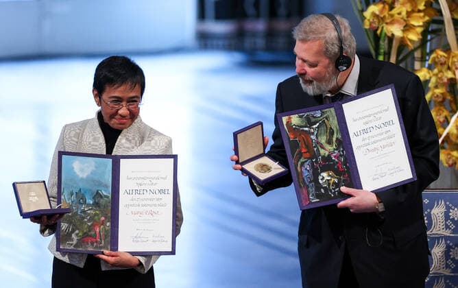 OSLO, NORWAY â€“ DECEMBER 10, 2021: Filipino-American journalist, co-founder and CEO of Rappler Maria Ressa (L) and Russian journalist, Novaya Gazeta editor-in-chief Dmitry Muratov are awarded the 2021 Nobel Peace Prize in recognition of their efforts to safeguard freedom of expression, which is a precondition for democracy and lasting peace , at a ceremony at Oslo City Hall. Sergei Bobylev TASS  TS11B5FE