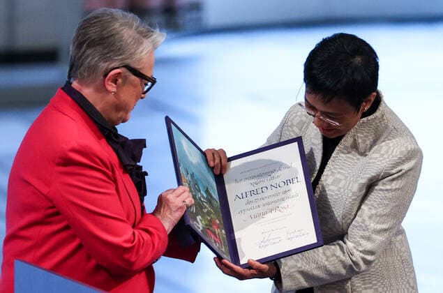 OSLO, NORWAY â€“ DECEMBER 10, 2021: Norwegian Nobel Committee Chairwoman Berit Reiss-Andersen (L) presents the 2021 Nobel Peace Prize to Filipino-American journalist, co-founder and CEO of Rappler Maria Ressa in recognition of her efforts to safeguard freedom of expression, which is a precondition for democracy and lasting peace , at a ceremony at Oslo City Hall. Sergei Bobylev TASS  TS11B5FC