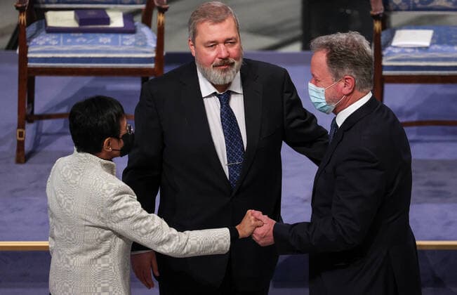 OSLO, NORWAY â€“ DECEMBER 10, 2021: Nobel Peace Prize winners, Filipino-American journalist, co-founder and CEO of Rappler Maria Ressa, Russian journalist, Novaya Gazeta editor-in-chief Dmitry Muratov, and World Food Programme Executive Director David Beasley (L-R) attend the 2021 Nobel Peace Prize award ceremony at the Oslo City Hall. The Norwegian Nobel Committee has decided to award the Nobel Peace Prize for 2021 to Maria Ressa and Dmitry Muratov in recognition of their efforts to safeguard freedom of expression, which is a precondition for democracy and lasting peace . The World Food Programme was awarded the Nobel Peace Prize for 2020. Sergei Bobylev TASS  TS11B621