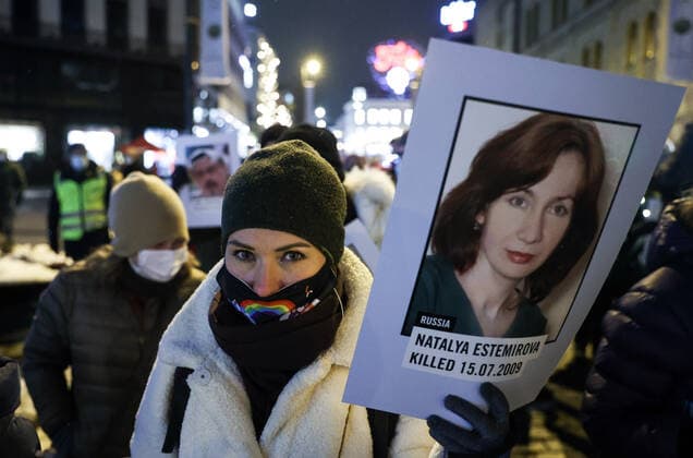 OSLO, NORWAY â€“ DECEMBER 10, 2021: People carry portraits of killed journalists during a torchlight parade in honour of the 2021 Nobel Peace Prize winners from Oslo Central Station to the Grand Hotel where the laureates greet the procession participants from the balcony. The Norwegian Nobel Committee has decided to award the Nobel Peace Prize for 2021 to Filipino-American journalist, co-founder and CEO of Rappler Maria Ressa and Russian journalist, Novaya Gazeta editor-in-chief Dmitry Muratov in recognition of their efforts to safeguard freedom of expression, which is a precondition for democracy and lasting peace . Sergei Bobylev TASS  TS11B66C