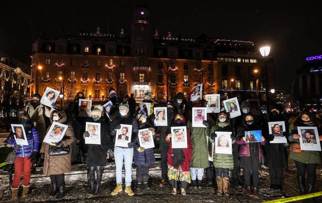 OSLO, NORWAY â€“ DECEMBER 10, 2021: People carry portraits of killed journalists during a torchlight parade in honour of the 2021 Nobel Peace Prize winners from Oslo Central Station to the Grand Hotel where the laureates greet the procession participants from the balcony. The Norwegian Nobel Committee has decided to award the Nobel Peace Prize for 2021 to Filipino-American journalist, co-founder and CEO of Rappler Maria Ressa and Russian journalist, Novaya Gazeta editor-in-chief Dmitry Muratov in recognition of their efforts to safeguard freedom of expression, which is a precondition for democracy and lasting peace . Sergei Bobylev TASS  TS11B66F