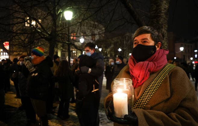 OSLO, NORWAY â€“ DECEMBER 10, 2021: People take part in a torchlight parade in honour of the 2021 Nobel Peace Prize winners from Oslo Central Station to the Grand Hotel where the laureates greet the procession participants from the balcony. The Norwegian Nobel Committee has decided to award the Nobel Peace Prize for 2021 to Filipino-American journalist, co-founder and CEO of Rappler Maria Ressa and Russian journalist, Novaya Gazeta editor-in-chief Dmitry Muratov in recognition of their efforts to safeguard freedom of expression, which is a precondition for democracy and lasting peace . Sergei Bobylev TASS  TS11B671