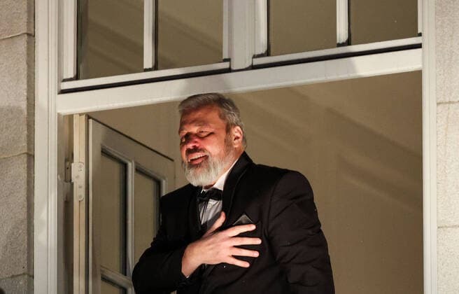 OSLO, NORWAY â€“ DECEMBER 10, 2021: Nobel Peace Prize winners, Russian journalist, Novaya Gazeta newspaper editor-in-chief Dmitry Muratov greets the participants in a torchlight parade in honour of the 2021 Nobel Peace Prize winners from a balcony of the Grand Hotel. The Norwegian Nobel Committee has decided to award the Nobel Peace Prize for 2021 to Filipino-American journalist, co-founder and CEO of Rappler Maria Ressa and Russian journalist, Novaya Gazeta editor-in-chief Dmitry Muratov in recognition of their efforts to safeguard freedom of expression, which is a precondition for democracy and lasting peace . Sergei Bobylev TASS  TS11B694