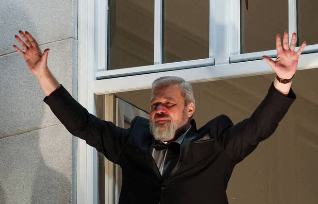 OSLO, NORWAY â€“ DECEMBER 10, 2021: Nobel Peace Prize winners, Russian journalist, Novaya Gazeta newspaper editor-in-chief Dmitry Muratov greets the participants in a torchlight parade in honour of the 2021 Nobel Peace Prize winners from a balcony of the Grand Hotel. The Norwegian Nobel Committee has decided to award the Nobel Peace Prize for 2021 to Filipino-American journalist, co-founder and CEO of Rappler Maria Ressa and Russian journalist, Novaya Gazeta editor-in-chief Dmitry Muratov in recognition of their efforts to safeguard freedom of expression, which is a precondition for democracy and lasting peace . Sergei Bobylev TASS  TS11B697