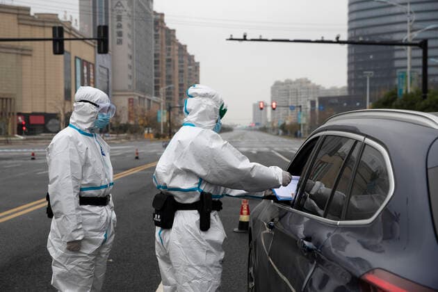 (211212) -- SHANGYU, Dec. 12, 2021 -- Staff members register information of a passing vehicle in Shangyu District of Shaoxing City, east China s Zhejiang Province, Dec. 12, 2021. East China s Zhejiang Province registered 138 locally-transmitted confirmed COVID-19 cases and one asymptomatic carrier between Dec. 5 and 3 p.m. Sunday, amid the latest COVID-19 resurgence. Of the total, 44 cases were reported in Ningbo, 77 cases and one asymptomatic carrier were in Shaoxing, and 17 cases were in the provincial capital of Hangzhou, said a provincial government press conference Sunday. (Photo by Xinhua) CHINA-ZHEJIANG-COVID-19-CASES (CN) ZhuxShengjun 