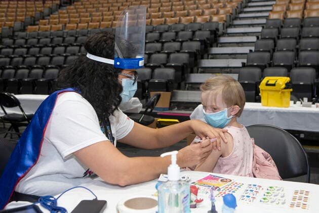 December 12, 2021, Toronto, ON, CANADA: Five-year-old Hannah Schmid receives her COVID-19 vaccine shot from Dr. Chetana Kulkarni from Sick Kids Hospital at a children s vaccine clinic held at the Scotiabank Arena, in Toronto, on Sunday, December 12, 2021. Toronto CANADA  - ZUMAc35_ 20211212_zaf_c35_013 Copyright: xChrisxYoungx