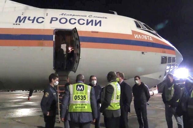 JOHANNESBURG, SOUTH AFRICA â€“ DECEMBER 14, 2021: A Russian Emergencies Ministry Ilyushin IL-76 transport aircraft is seen at an airport in Johannesburg. Russia has sent a team of virologists, epidemiologists, Rospotrebnadzor and Russian Health Ministry medical workers, Russian Emergencies Ministry officers and a Kamaz lorry equipped with a mobile laboratory of the Rospotrebnadzor Agency to South Africa amid the COVID-19 pandemic. The mission has been ordered by Russiaâ€™s President Putin in response to a request from South African President Ramaphosa. On 25 November 2021, the South African Ministry of Health reported the emergence of the Omicron variant of SARS-CoV-2 which causes COVID-19. Russian Emergencies Ministry TASS THIS IMAGE WAS PROV  TS11BC1C