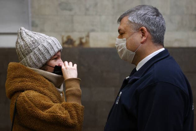 NOVOSIBIRSK, RUSSIA - DECEMBER 17, 2021: Andrei Benimetsky (R), deputy head of the passenger transportation department of the Novosibirsk Region Transport and Road Infrastructure Ministry, checks face mask compliance at Ploshchad Lenina Station of the Novosibirsk Underground. Russia s Novosibirsk Region has been placed on a high alert amid a rise in COVID-19 cases, the face mask mandate applying to all public venues. Kirill Kukhmar TASS  TS11C195