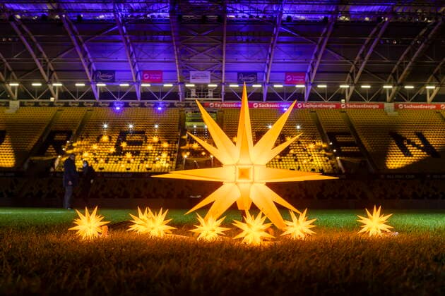 CHRISTMAS SONGS SINGING IN THE DYNAMOSTADION FOR PANDEMIC REASONS PLEASANTLY WITHOUT PUBLIC Photo opportunity In the empty Rudolf Harbig Stadium The Kreuzchor under the direction of Kreuzkantor Roderich Kreile 65 will conduct a concert of Christmas carols Around 60 singers will perform a program illuminated by Herrnhut stars Dresden Saxony GERMANY