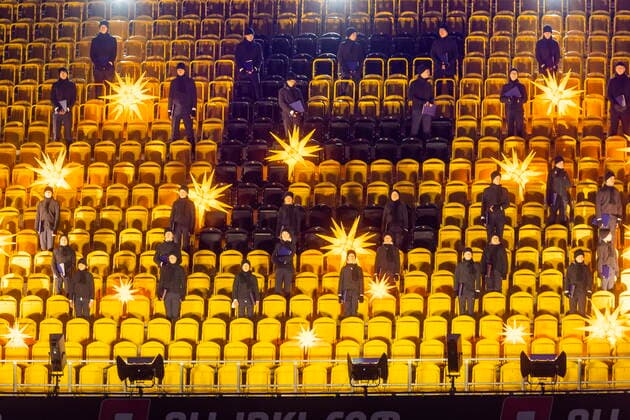 CHRISTMAS SONGS SINGING IN THE DYNAMOSTADION FOR PANDEMIC REASONS PLEASANTLY WITHOUT PUBLIC Photo opportunity In the empty Rudolf Harbig Stadium The Kreuzchor under the direction of Kreuzkantor Roderich Kreile 65 will conduct a concert of Christmas carols Around 60 singers will perform a program illuminated by Herrnhut stars Dresden Saxony GERMANY