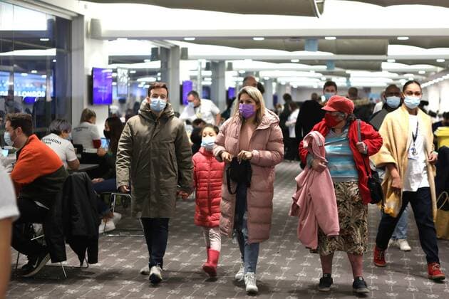 December 18, 2021, London, United Kingdom: People seen walking around the vaccination centre..The Chelsea Stamford Stadium was used as an NHS vaccination centre providing a marathon of jabs ˜Jabathon™. Bookings began from 10am as members of the military and NHS provided the vaccination. London United Kingdom - ZUMAs197 20211218_zaa_s197_137 Copyright: xBelindaxJiaox