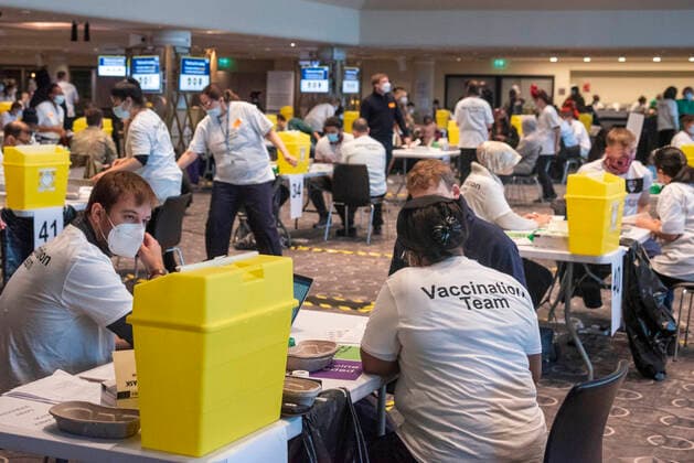 (211220) -- LONDON, Dec. 20, 2021 -- Photo taken on Dec. 19, 2021 shows a general view of NHS (National Health Service) COVID Vaccine Center at Wembley Stadium in London, Britain. (Photo by Xinhua) UK-LONDON-COVID-19-VACCINATION CENTER RayxTang 