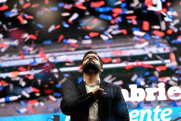(211220) -- SANTIAGO, Dec. 20, 2021 -- Chile s president-elect Gabriel Boric makes a public speech in Santiago, Chile, Dec. 19, 2021. Left-leaning candidate Gabriel Boric won the Chilean presidential election on Sunday, after his rival -- right-wing candidate Jose Antonio Kast -- conceded, making him the youngest elected president in Chile s history. (Photo by Xinhua) CHILE-SANTIAGO-PRESIDENT ELECTION JorgexVillegas 