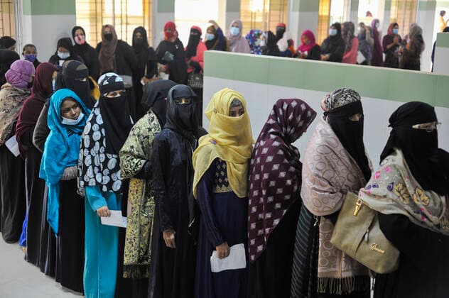 December 20, 2021: 20 December 2021 Sylhet, Bangladesh: Women queue to be able to receive a Pfizer dose against Covid-19 disease at the M A G Osmani medical college & hospital vaccination center in Sylhet. Meanwhile, in Dhaka city of Bangladesh launched the COVID-19 booster shot campaign from Sunday with Pfizer vaccine to scale up its efforts for containing the spread of the lethal virus. - ZUMAr143 20211220_zap_r143_012 Copyright: xMdxRafayatxHaquexKhanx