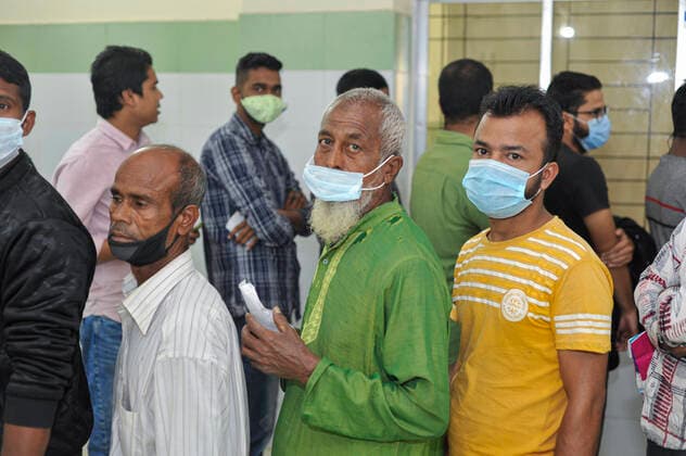 December 20, 2021: 20 December 2021 Sylhet, Bangladesh: Aged people queue to be able to receive a Pfizer 2nd dose against Covid-19 disease at the M A G Osmani medical college & hospital vaccination center in Sylhet. Meanwhile, in Dhaka city of Bangladesh launched the COVID-19 booster shot campaign from Sunday with Pfizer vaccine to scale up its efforts for containing the spread of the lethal virus. - ZUMAr143 20211220_zap_r143_016 Copyright: xMdxRafayatxHaquexKhanx