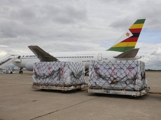 (211220) -- HARARE, Dec. 20, 2021 -- A batch of COVID-19 vaccine donated by China arrives at Robert Gabriel Mugabe International Airport in Harare, Zimbabwe, on Dec. 20, 2021. Zimbabwe on Monday received a batch of Sinovac COVID-19 vaccine donated by China, which will boost the country s vaccination campaign as it battles the fourth wave of COVID-19 pandemic. ) ZIMBABWE-HARARE-CHINA-COVID-19 VACCINE-MEDICAL SUPPLIES-DONATION ZhangxYuliang 