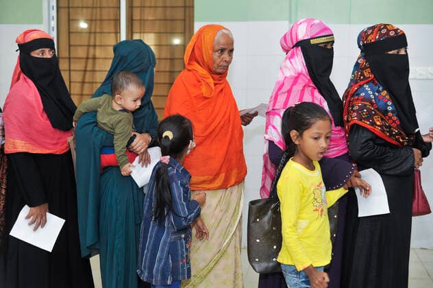 December 23, 2021: Sylhet, Bangladesh: Women queue to be able to receive a Pfizer dose against Covid-19 disease at the M A G Osmani medical college & hospital vaccination center in Sylhet. Meanwhile, in Dhaka city of Bangladesh launched the COVID-19 booster shot campaign with Pfizer vaccine to scale up its efforts for containing the spread of the lethal virus. - ZUMAr143 20211223_zap_r143_004 Copyright: xMdxRafayatxHaquexKhanx