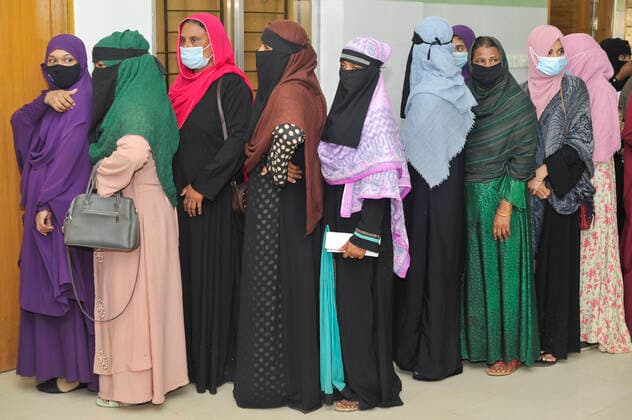December 23, 2021: Sylhet, Bangladesh: Women queue to be able to receive a Pfizer dose against Covid-19 disease at the M A G Osmani medical college & hospital vaccination center in Sylhet. Meanwhile, in Dhaka city of Bangladesh launched the COVID-19 booster shot campaign with Pfizer vaccine to scale up its efforts for containing the spread of the lethal virus. Sylhet Bangladesh - ZUMAr143 20211223_zap_r143_009 Copyright: xMdxRafayatxHaquexKhanx