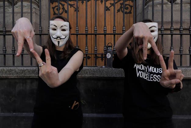 Anonymous For The Voiceless Demonstrates Against Animal Exploitation In Mexico City Members of the international animal rights organisation Anonymous for the Voiceless, perform the Go Vegan sign while demonstrating in the streets of the Historic Centre of Mexico City, against the consumption of animals on the occasion of Christmas and New Year s Eve during the COVID-19 health emergency in the country. Mexico City Mexico  Copyright: xGerardoxVieyrax originalFilename: vieyra-notitle211224_npwUI.jpg